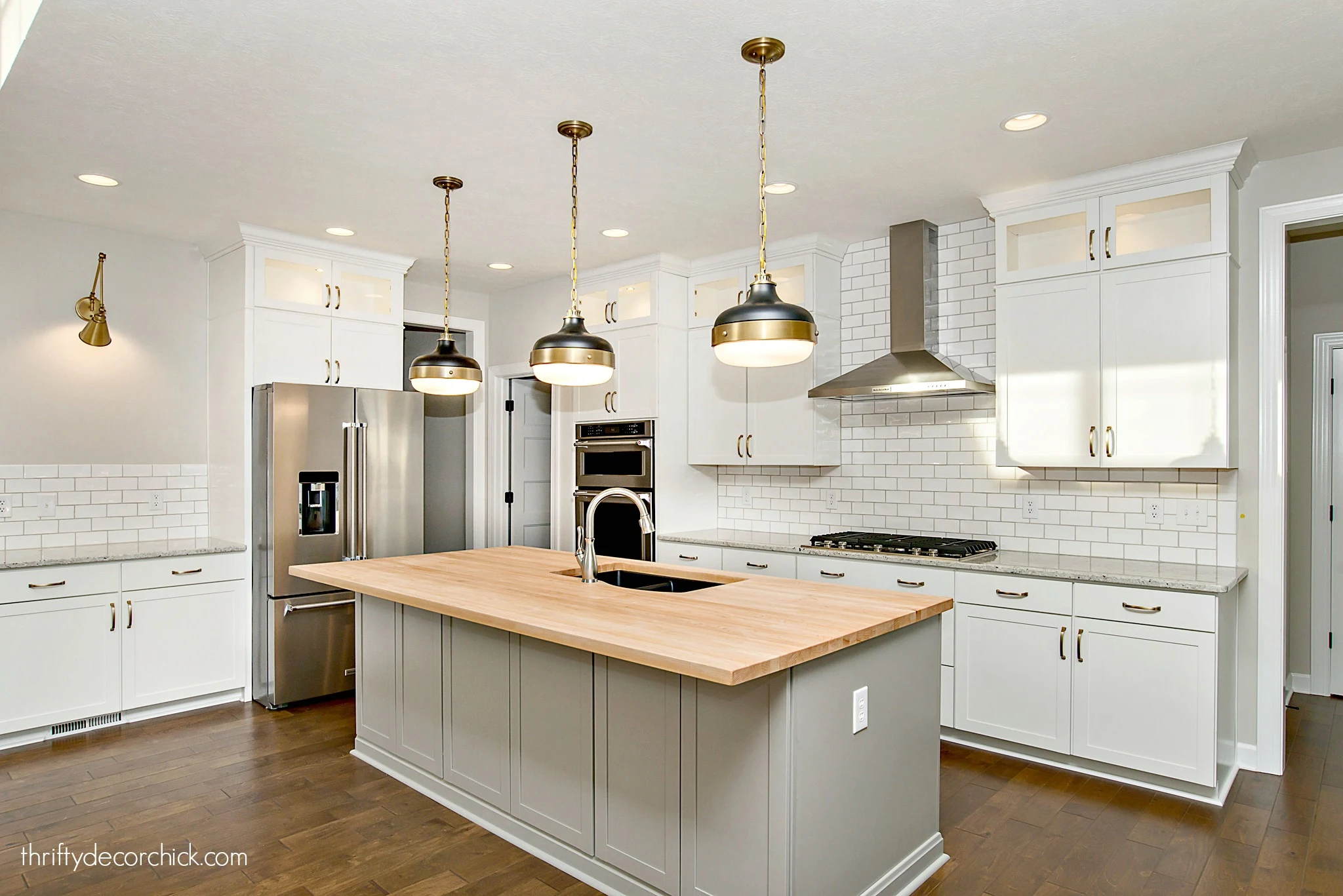 white kitchen with butcher block island