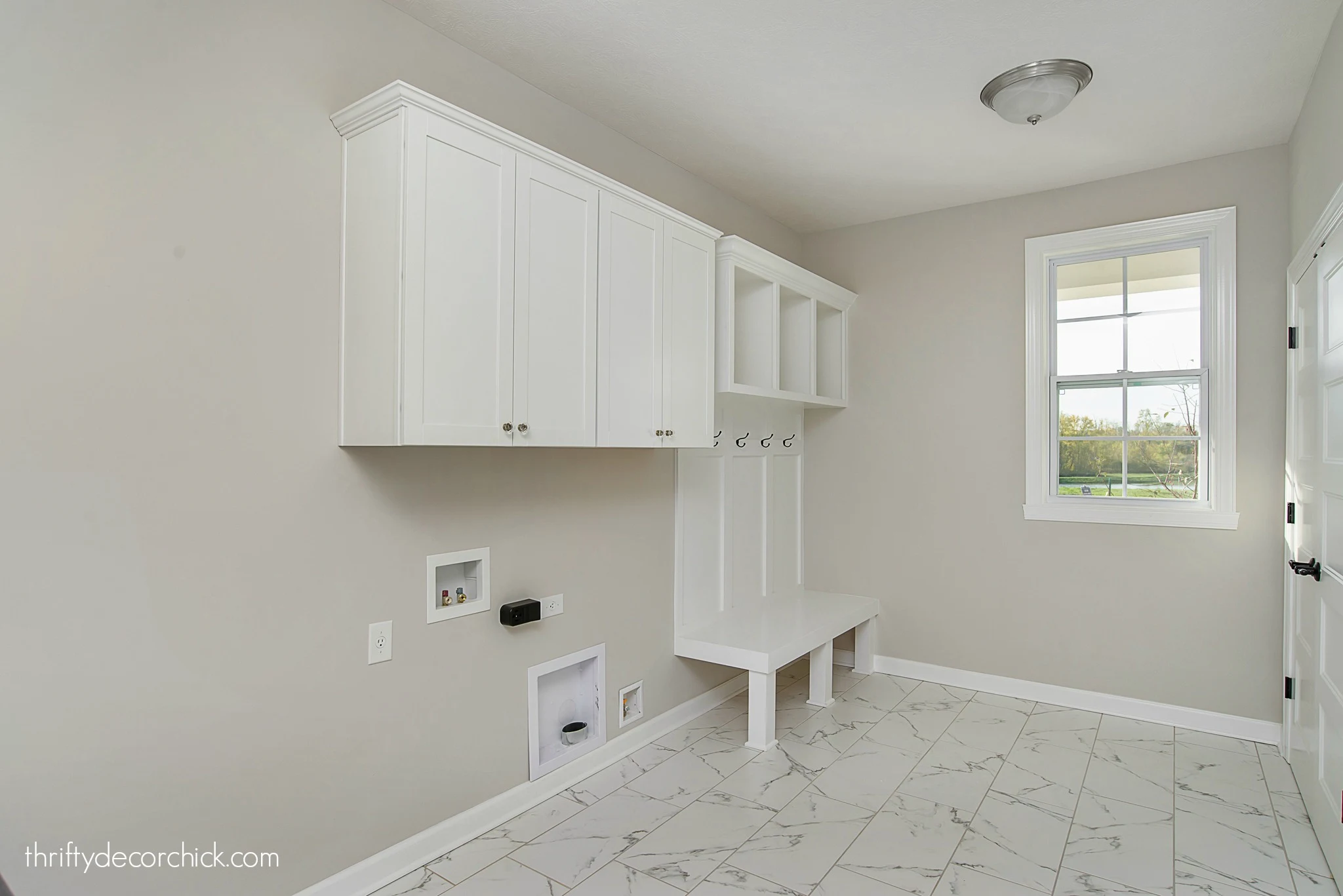 laundry room with mud room bench