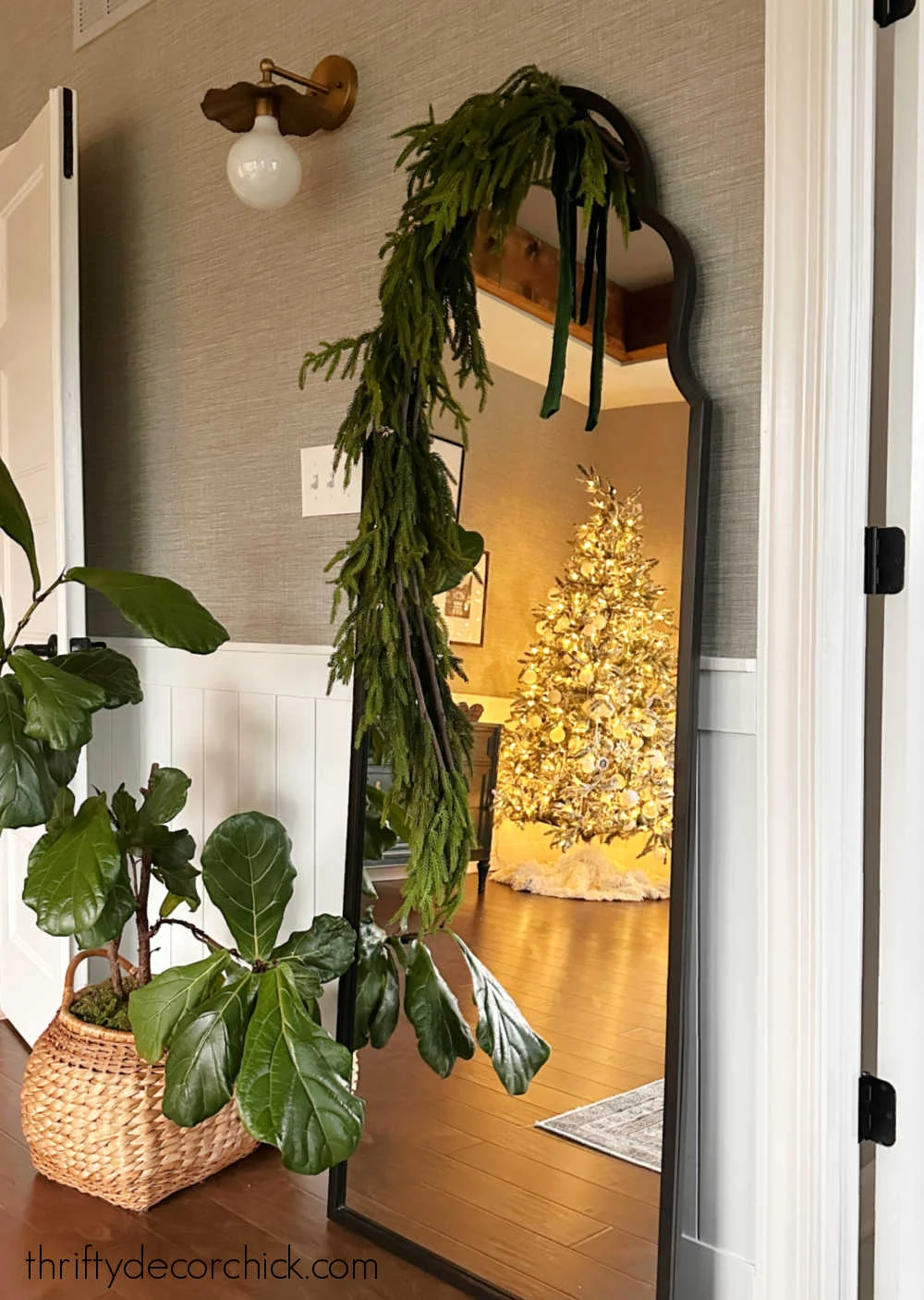 garland draped over leaning mirror