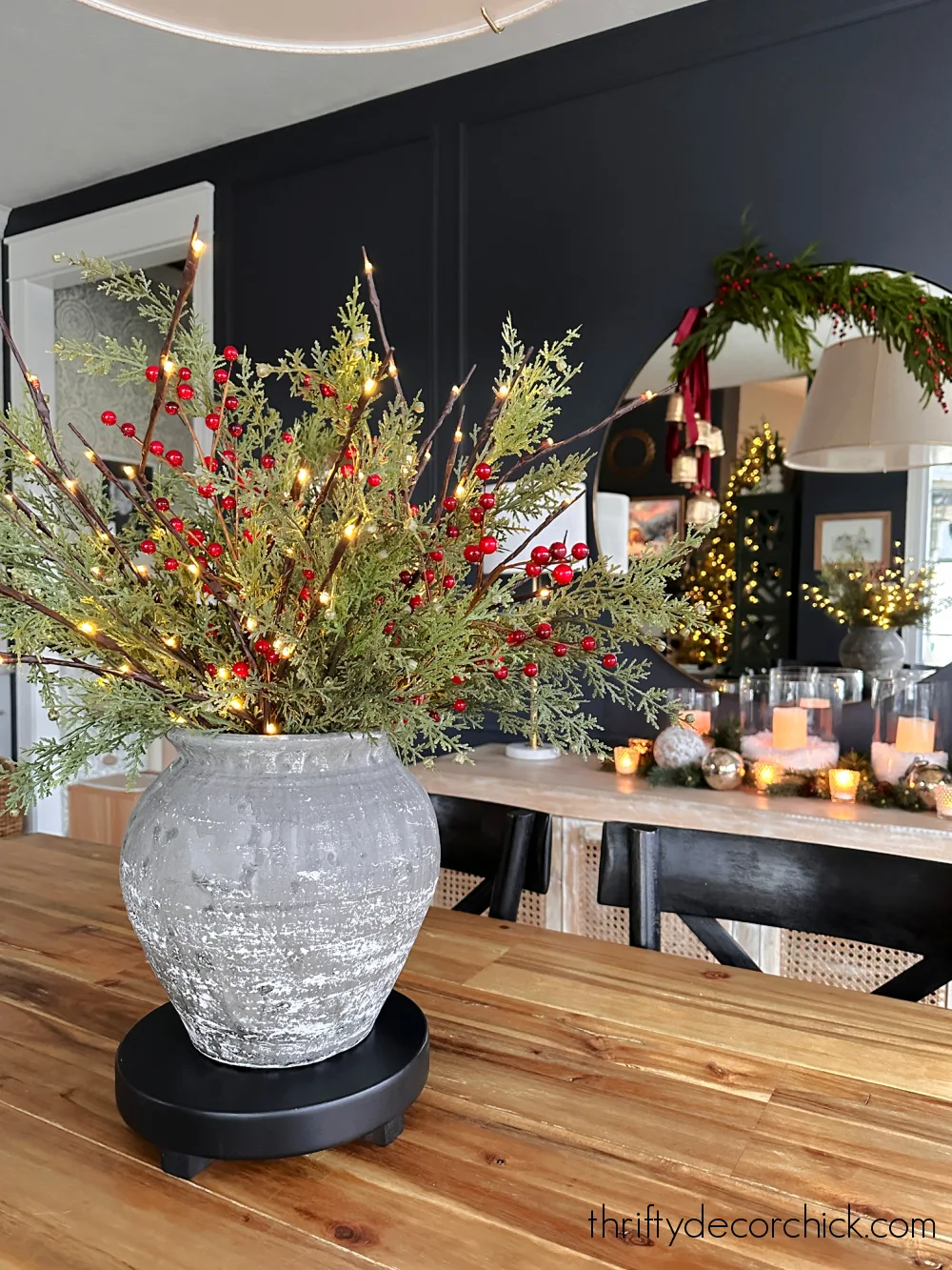 berries and greenery in vase