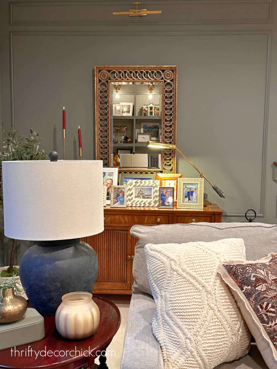 various framed photos on dresser