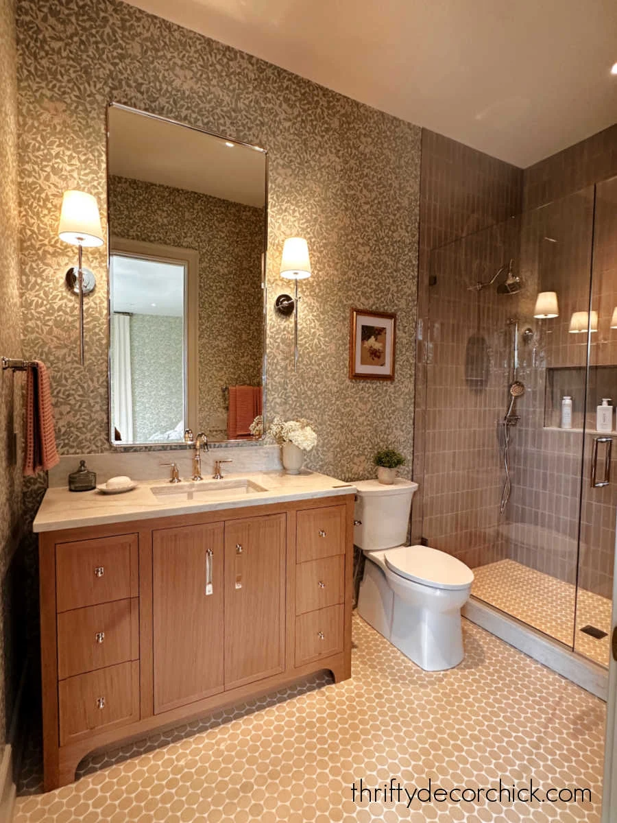 green mauve tile and wallpaper in bathroom